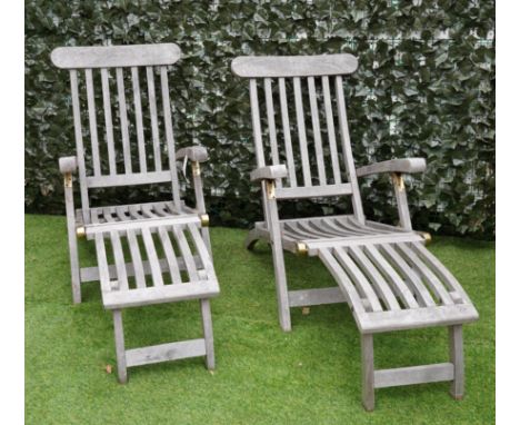 A PAIR OF HARDWOOD STEAMER CHAIRS (2)Each 59cm wideCondition report:&nbsp;AS can been seen in the illustration they are sligh