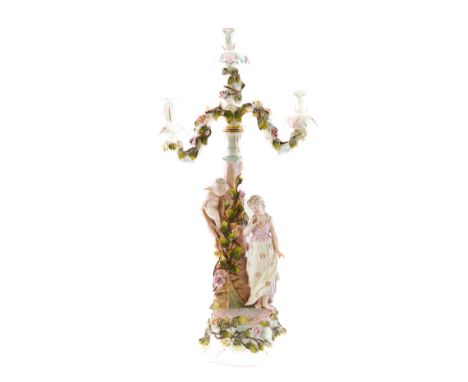 A SITZENDORF FOUR-LIGHT CANDELABRUMLate 19th centuryModelled with a young woman standing beside a flower encrusted tree with 