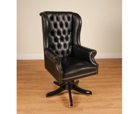 RALPH LAUREN; A CHAIRMAN BRASS STUDDED BLACK LEATHER UPHOLSTERED WINGBACK SWIVEL OFFICE CHAIR77cm wide; 134cm highCondition r