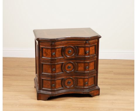 MICHAEL AMINI; A WALNUT THREE DRAWER COMMODE OF 18TH CENTURY GERMAN STYLEWith brushing slide, 71cm wide; 51cm deep; 72cm high
