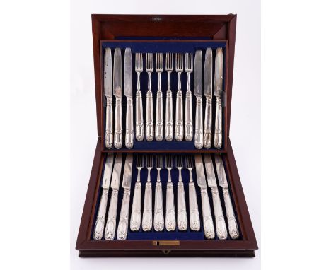 A SET OF TWELVE SILVER PAIRS OF DESSERT KNIVES AND FORKShaving loaded silver handles all London 1822, with a mahogany case.Tw