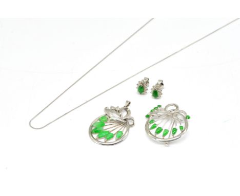 THREE ITEMS OF JADE JEWELLERY (3)Comprising a pendant necklace, marked 14 K, together with a matching brooch and a pair of ja