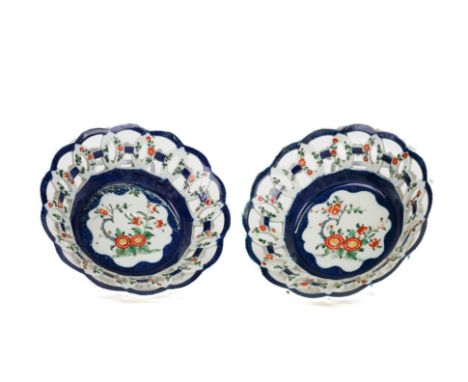 A PAIR OF WORCESTER SMALL SCALE-BLUE GROUND SHALLOW PIERCED BASKETS (2)Circa 1775Of the `Red line Bordered group', painted wi