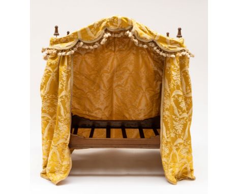 A 20TH CENTURY NOVELTY CAT/DOLL’S BED FORMED AS A BOBBIN TURNED FOUR POSTER BED52cm wide; 32cm deep; 66cm highCondition Repor