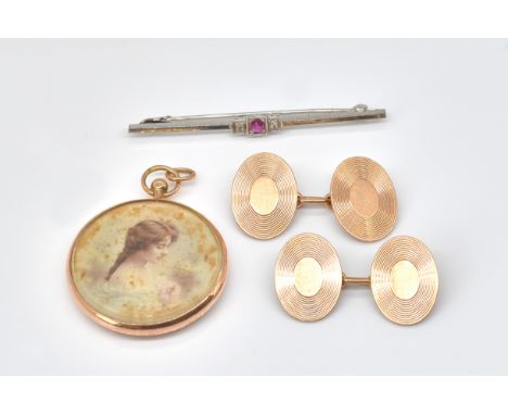 AN ART DECO RUBY AND DIAMOND BAR BROOCH (3)marked 9 ct PLAT, together with a pair of 9 ct gold engine turned oval cufflinks, 