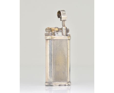 A DUNHILL SILVER PLATED GAS LIGHTEROf curved rectangular form, with engine turned decoration, detailed Dunhill Unique, Made i