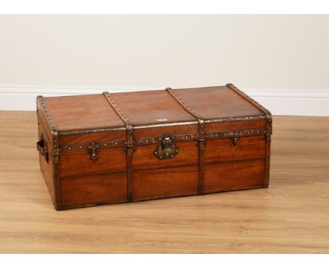 AN EARLY 20TH CENTURY BRASS-BOUND CAMPHOR WOOD TRAVELLING TRUNK100cm wide; 57cm deep; 38cm high