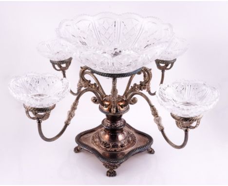 A PLATED TABLE CENTREPIECE EPERGNEThe stand with a central ring supporting the principal faceted glass dish and with four scr