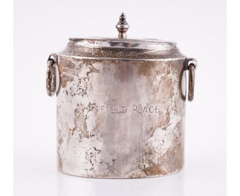 A SILVER OVAL TWIN HANDLED TEA CADDYThe body engraved Winkfield Place, the side with circular loop form handles, London 1899,