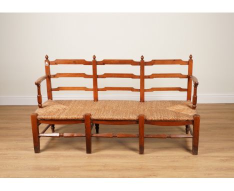 A 19TH CENTURY PINE FRAMED TRIPLE LADDER CHAIR BACK RUSH SEAT SETTLE167cm wide; 58cm deep; 92cm high