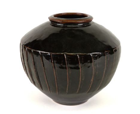 DAVID LEACH ( 1911-2005) A LARGE STUDIO POTTERY VASEStoneware, fluted sides beneath a tenmoku glaze. impressed DL seal, 21.5c