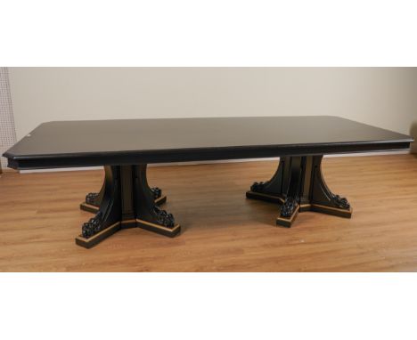 PROBABLY RALPH LAUREN; A LARGE EBONISED CANTED RECTANGULAR DINING TABLE ON DUAL LION’S PAW PEDESTALS121cm wide; 308cm longCon