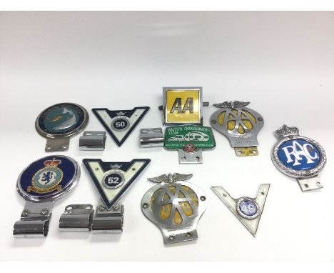 A collection of various vintage car badges including AA and RAC. No reserve