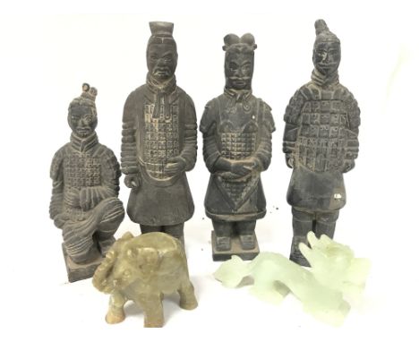 A group of Terracotta Asian warriors (16.5cm tall approx) a, a jade dragon and a soapstone elephant