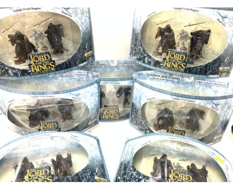 A collection of boxed lord of the rings figures.