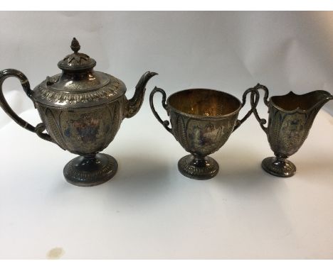 A Victorian piece silver plated tea service with ornate decoration.
