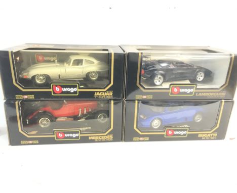 Four Diamonds eighteenth scale model cars including: a 1961Jaguar E coupe, a 19888 Lamborghini countachi, a 1928 Mercedes Ben