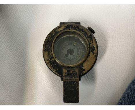 A WWII military issue compass.