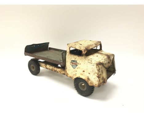A vintage tin plate toy truck.