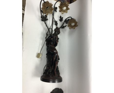 A heavy resin lamp with glass shades 94cm tall and one other resin figurine.