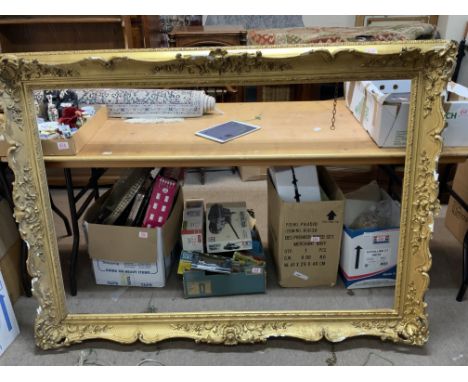 A large early gilt gesso and wooden picture frame. External 157 x 115cm .internal 92 x 134cm