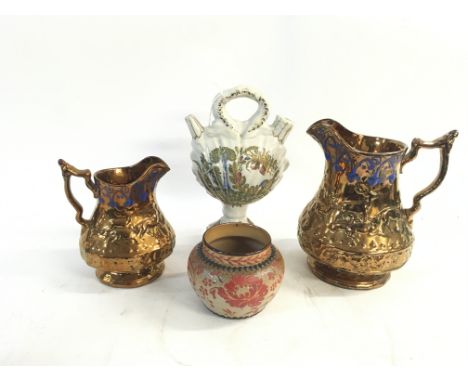 Four vintage ceramic pottery pieces. Including: Two vintage copper blue pitchers decorated with deers sizes vary, one small c