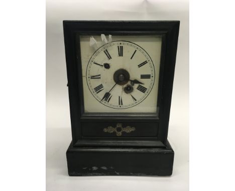 A French 8 day wood cased clock with key.