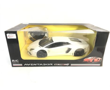 A Rastar 1/14 scale Remote controlled model White Lamborghini Aventador still in, slightly damaged, original packaging. No re