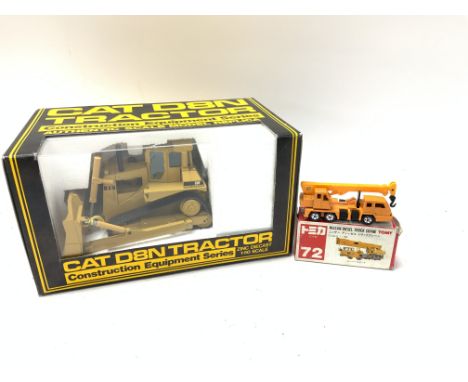 A Boxed NZG models Cat D8N Tractor 1:50 Scale and a Tomy Nissan diesel truck crane. No reserve.