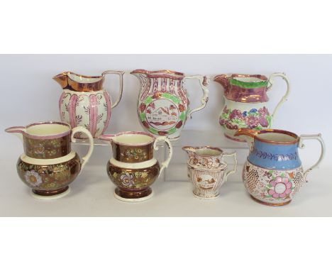 Graduated pair of 19th century pottery jugs with copper and pink lustre banding and polychrome painted decoration, 15cm and 1