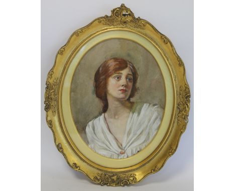 Late 19th or Early 20th Century British School. Portrait of a lady. Watercolour and gouache over pencil. 21cm x 16cm (oval). 