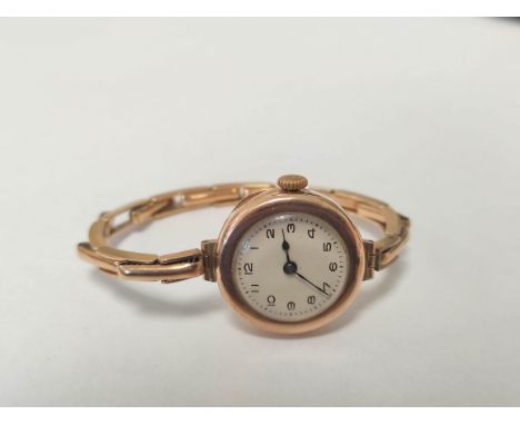 9ct gold cased 15 jewel lady's watch on 9ct gold expandable bracelet. case made by the City Watch Case Co, London hallmarks 1
