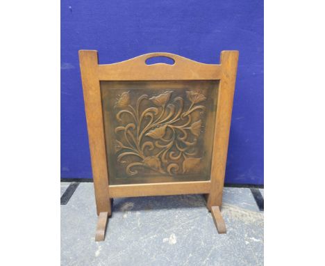 Art Nouveau hammered copper firescreen, the panel decorated with entwined stylised flowerheads, 47cm x 47cm, framed in oak, o
