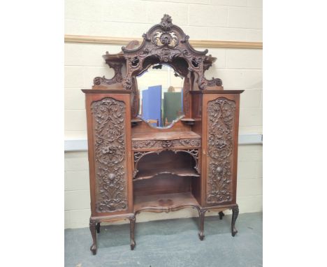 Ornate late Victorian mahogany side cabinet, c.1900, with canopy top above mirror, central drawer and shelves flanked by cupb