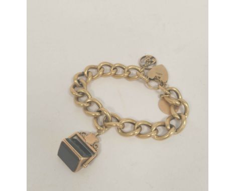 Gold hollow curb bracelet with rotating seal and two charms, 42g gross. 