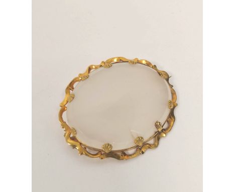 Victorian oval white chalcedony brooch in gold wavy mount, probably 15ct, 63mm x 54mm. 42g gross. 