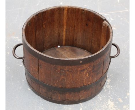 Antique oak planter or log bucket of coopered twin handled barrel form, approx. 62cm wide, 30cm high. 