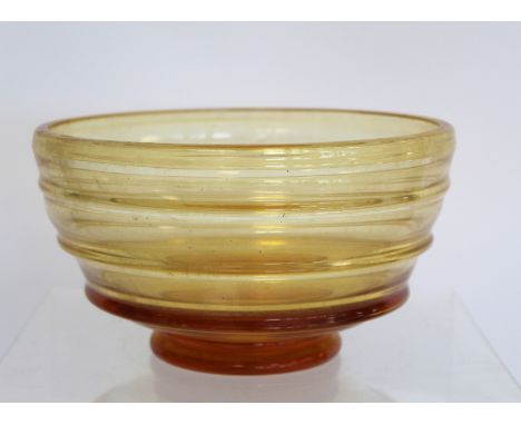 Barnaby Powell for Whitefriars ribbon trailed amber glass footed bowl with polished base, 21cm diam.