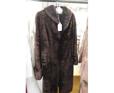 A lady's faux beaver weatherproof lambskin coat by Martins Glamar, together with a lady's musquash (?) fur jacket, (2)