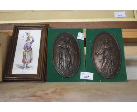Two pressed decorative plaques and a framed ceramic tile