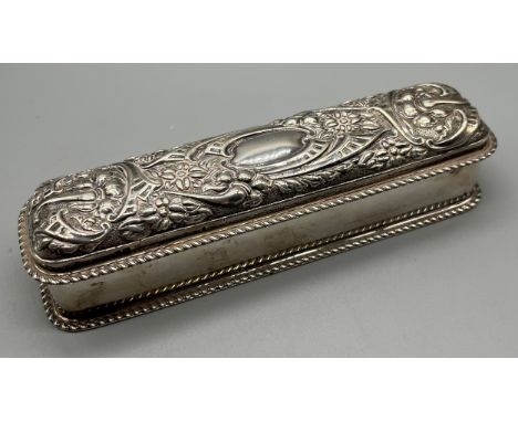 Birmingham silver ring box, designed with a raised relief ornate lid. Produced by William Hutton &amp; Sons Ltd. [3.8x17x4cm]