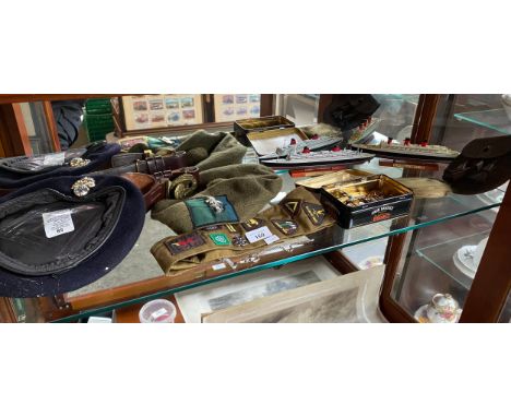 A Shelf of military and girl guide collectables to include two model ship boats, leather child's sporran and girl guide sash.