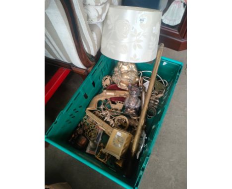 A crate of brass ware to include buddha lamp, brass revolver gun, antique garden sprayer and horse brasses. 