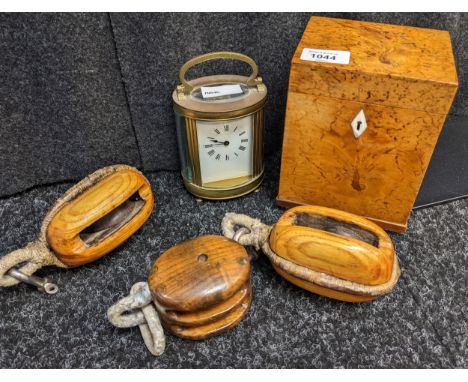 Mixed lot to include; antique brass French carriage clock, Walnut lidded tea caddy and three wooden pully blocks [5] 