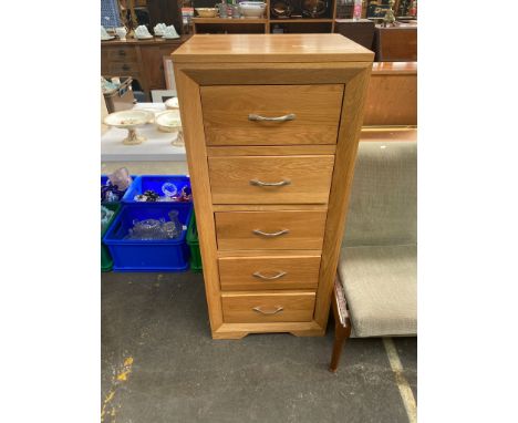 Light oak five drawer slimline chest of drawers. 