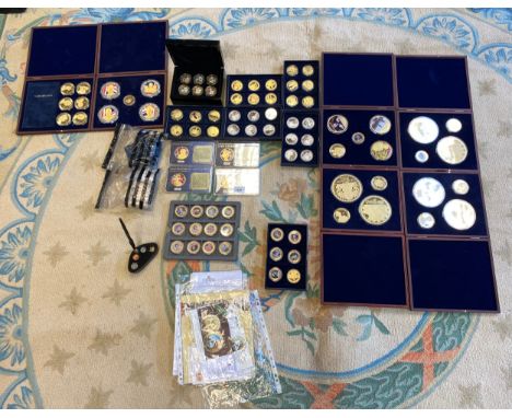 Large collection of gold and silver plated Royalty and Commemorative cased coins, comes with certificates and boxes.