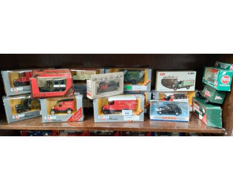 Shelf of boxed Corgi and Dinky vehicles. 