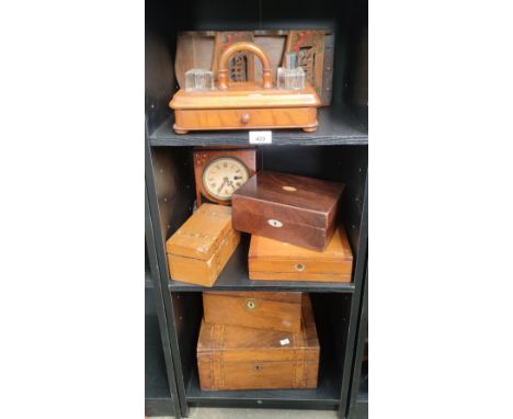 Three shelves of antique wooden items to include document boxes, writing slopes, tea caddy, mantel clock and antique ink well