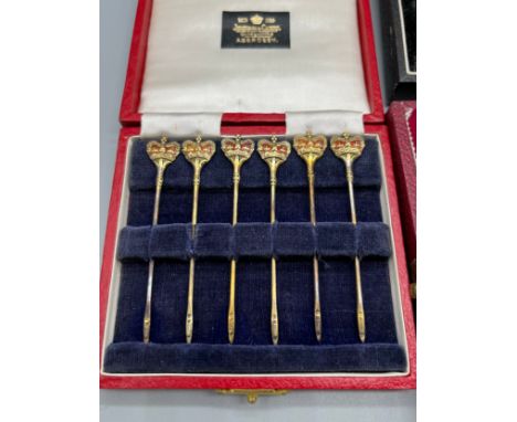 Three boxed silver items. A Set of 6 Birmingham and enamel jubilee marked toothpicks produced by Adie Brothers Ltd. A Pair of