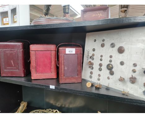 Shelf of 19th century brass carriage clock cases and two sleeves of military antique uniform buttons. 